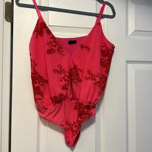 NBD pink bodysuit purchased from REVOLVE